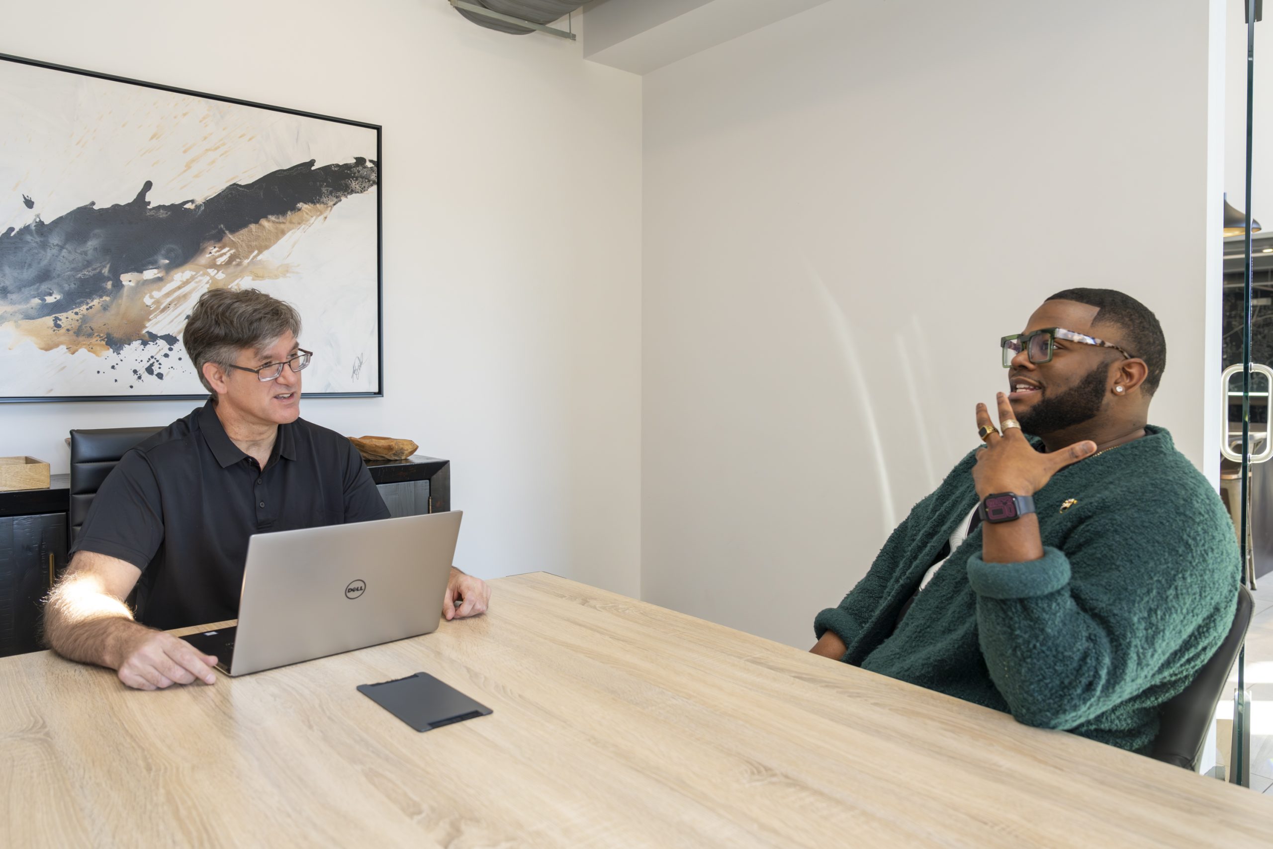 Patrick Hefferan speaking with one of his clients